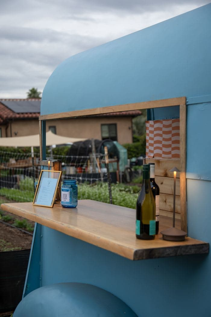 The live edge bar top with bottles and a menu